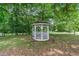 Picturesque gazebo nestled among mature trees, perfect for relaxation and outdoor gatherings at 8136 Connally Dr, Douglasville, GA 30134