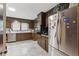This kitchen features stainless steel appliances, dark cabinets and linoleum floors at 8136 Connally Dr, Douglasville, GA 30134