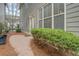 Back patio featuring a stone walkway, mature plantings and nice landscaping at 319 Barbados Ln, Suwanee, GA 30024