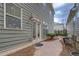 Back yard featuring a stone walkway, mature plantings and landscaping at 319 Barbados Ln, Suwanee, GA 30024