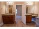 Ensuite bathroom featuring granite counters with double sinks and tile flooring at 319 Barbados Ln, Suwanee, GA 30024