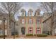 Charming two-story home featuring red shutters and dormer windows, nestled in a quiet neighborhood at 319 Barbados Ln, Suwanee, GA 30024