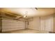 Spacious two-car garage featuring an automatic door, bright lighting, and ample storage space at 319 Barbados Ln, Suwanee, GA 30024