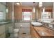 Bathroom featuring a glass-enclosed shower, elegant vanity with vessel sink, and stylish fixtures at 625 Kennesaw Ave, Atlanta, GA 30308