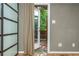 Bedroom with hardwood floors, built in closet, and door to the outdoor space at 625 Kennesaw Ave, Atlanta, GA 30308