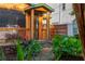 Attractive home featuring a cozy porch, complemented by vibrant greenery and a brick pathway to the entrance at 625 Kennesaw Ave, Atlanta, GA 30308