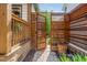 Charming wooden gate and brick pathway in a beautifully landscaped yard at 625 Kennesaw Ave, Atlanta, GA 30308