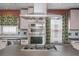 Updated kitchen showcasing modern appliances, sleek countertops, and a stylish range hood at 625 Kennesaw Ave, Atlanta, GA 30308