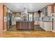 Modern kitchen featuring a large island, stainless steel appliances, custom cabinetry and hardwood floors at 625 Kennesaw Ave, Atlanta, GA 30308