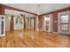 Beautifully designed living room featuring hardwood floors, a ceiling fan, recessed lights and an exterior door at 625 Kennesaw Ave, Atlanta, GA 30308