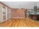 Lovely living room showcasing hardwood floors, a chandelier, an exterior door and access to the kitchen at 625 Kennesaw Ave, Atlanta, GA 30308