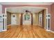 Open concept living room with hardwood floors, columns, large windows and recessed lighting at 625 Kennesaw Ave, Atlanta, GA 30308