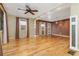 Inviting living room featuring hardwood floors, ceiling fan, recessed lighting, and large windows at 625 Kennesaw Ave, Atlanta, GA 30308