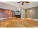 Spacious living room with hardwood floors, open to kitchen, lots of recessed lights and a ceiling fan at 625 Kennesaw Ave, Atlanta, GA 30308