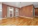 Inviting living room displaying hardwood floors, a chandelier, an exterior door and neutral wall color at 625 Kennesaw Ave, Atlanta, GA 30308