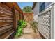 Landscaped side yard featuring stone pathway, privacy fencing, and lush greenery at 625 Kennesaw Ave, Atlanta, GA 30308