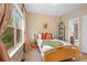 Bright bedroom with a large window and stylish furnishings at 6250 Vista Crossing Way, Cumming, GA 30028