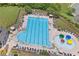 Aerial view of the neighborhood pool highlighting lounge areas, lap lanes, and a colorful splash pad for children at 6250 Vista Crossing Way, Cumming, GA 30028