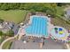 Aerial view of the community pool with lap lanes, lounge chairs, and ' splash pad, perfect for summer fun at 6250 Vista Crossing Way, Cumming, GA 30028