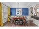 Cozy dining room with stylish decor, hardwood floors, and ample space for Gathering gatherings at 6250 Vista Crossing Way, Cumming, GA 30028