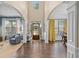 Inviting foyer with high ceilings, hardwood floors, and decorative columns leading to living spaces at 6250 Vista Crossing Way, Cumming, GA 30028