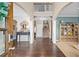 Welcoming foyer with hardwood floors, soaring ceilings, and an elegant staircase leading to the upper level at 6250 Vista Crossing Way, Cumming, GA 30028