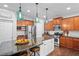Modern kitchen with stainless steel appliances, center island, and custom cabinetry at 6250 Vista Crossing Way, Cumming, GA 30028