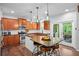 Well-appointed kitchen with hardwood floors, stainless appliances, and center island at 6250 Vista Crossing Way, Cumming, GA 30028