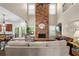 Open living area with soaring ceilings, stone fireplace, and hardwood floors at 6250 Vista Crossing Way, Cumming, GA 30028
