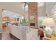 Bright living room with stone fireplace, soaring ceilings, open to the kitchen, and filled with natural light at 6250 Vista Crossing Way, Cumming, GA 30028