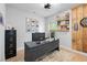 Home office features modern design, built-in shelves, and a large desk with dual monitors at 6250 Vista Crossing Way, Cumming, GA 30028