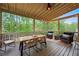 Outdoor patio with ample seating, ideal for enjoying the surrounding nature at 6250 Vista Crossing Way, Cumming, GA 30028