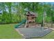 Backyard play area with a slide, swings, and climbing structure, perfect for children at 6250 Vista Crossing Way, Cumming, GA 30028