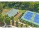 Aerial view of basketball and tennis courts, surrounded by lush landscaping at 6250 Vista Crossing Way, Cumming, GA 30028