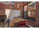 Balcony with table and chairs with a red brick exterior at 791 Wylie Se St # 912, Atlanta, GA 30316