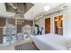 Main bedroom with spiral staircase, exercise bike, brick wall and ensuite bathroom at 791 Wylie Se St # 912, Atlanta, GA 30316