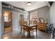 Modern dining room with a wooden table set, dresser, and a glimpse into an adjoining bathroom at 791 Wylie Se St # 912, Atlanta, GA 30316