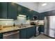 A kitchen featuring shaker cabinets, stainless appliances, and stone countertops at 791 Wylie Se St # 912, Atlanta, GA 30316