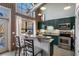 Well-lit kitchen with stainless steel appliances, granite countertops, and a breakfast bar under lofted ceilings at 791 Wylie Se St # 912, Atlanta, GA 30316