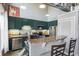 A kitchen featuring shaker cabinets, stainless appliances, and stone countertops with breakfast bar at 791 Wylie Se St # 912, Atlanta, GA 30316