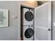 Hall closet featuring a stacked washer and dryer, maximizing space efficiency at 791 Wylie Se St # 912, Atlanta, GA 30316