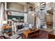 Open-concept living room featuring a spiral staircase, modern furniture, and stainless steel appliances in the kitchen at 791 Wylie Se St # 912, Atlanta, GA 30316