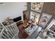 Aerial view of a comfortable living room with spiral staircase, tv, and an open floor plan at 791 Wylie Se St # 912, Atlanta, GA 30316