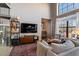 Cozy living room featuring an oriental rug, shelving, and large windows with natural light at 791 Wylie Se St # 912, Atlanta, GA 30316