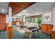 Finished basement with a recreational area, ample seating, and paneled walls at 1498 Camp Point Ne Ct, Roswell, GA 30075