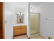 Bathroom featuring a glass door shower and vanity with sink at 1498 Camp Point Ne Ct, Roswell, GA 30075