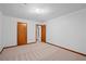 Spacious bedroom featuring plush carpeting and white walls with wood trim at 1498 Camp Point Ne Ct, Roswell, GA 30075