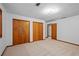 Bedroom with carpet, two closets, and access to the bathroom at 1498 Camp Point Ne Ct, Roswell, GA 30075