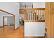 Open foyer boasts wooden railings and trim with views to other rooms and access to the stairway at 1498 Camp Point Ne Ct, Roswell, GA 30075
