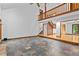 Open-concept living room featuring stone fireplace, expansive flooring and staircase at 1498 Camp Point Ne Ct, Roswell, GA 30075
